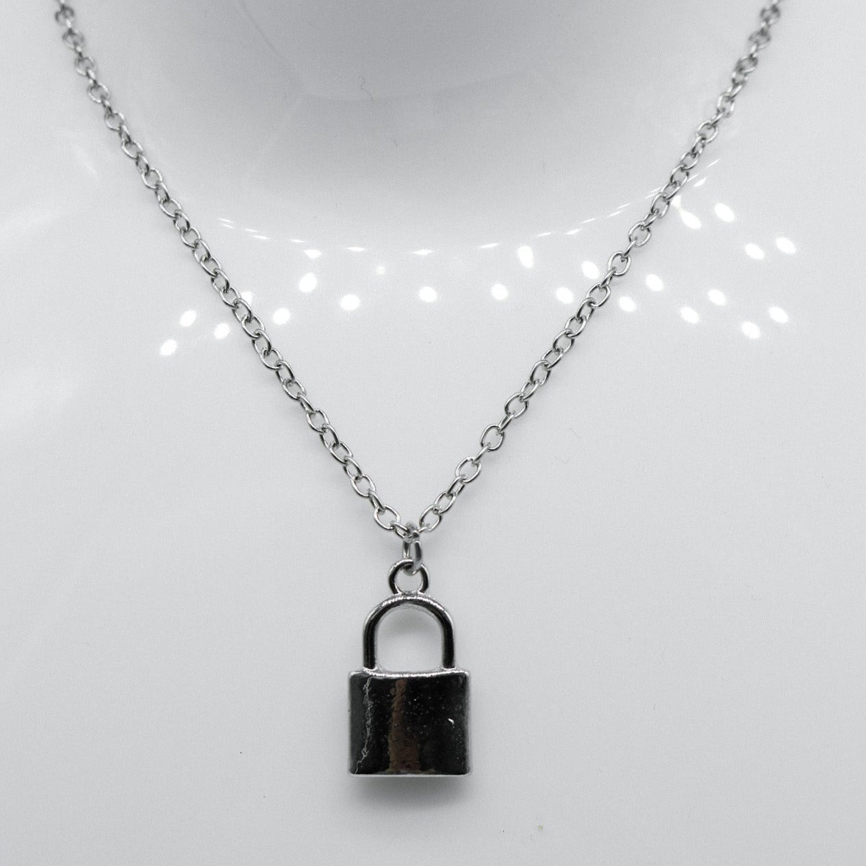 Silver lock pendant on sale necklace